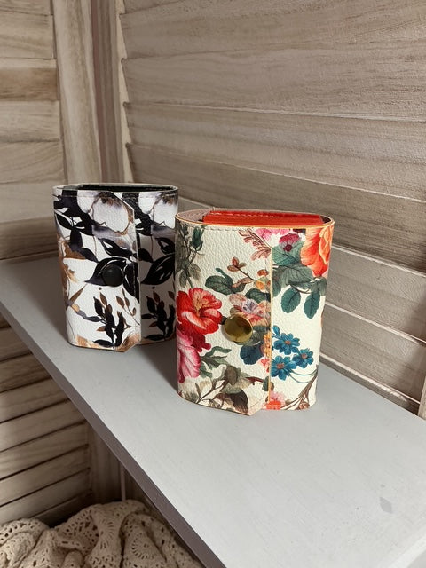 Floral patterned wallet on a wooden surface