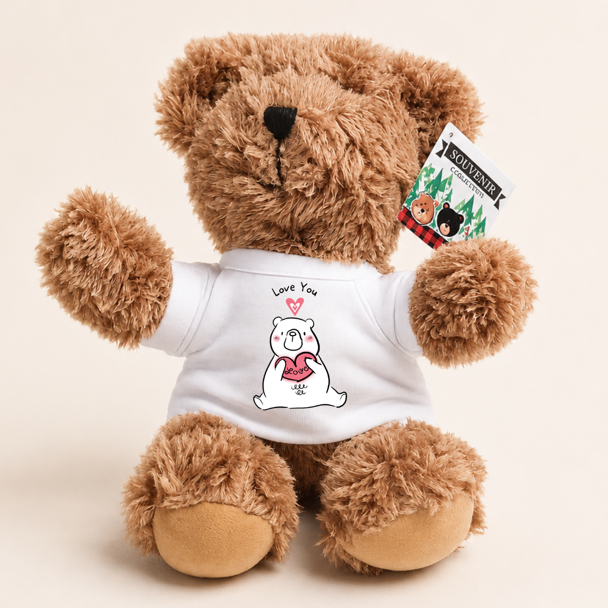 A brown plush teddy bear wearing a white T-shirt with a cute cartoon bear graphic and the text 'Love You' and 'SOWING'.