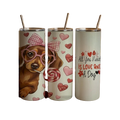 Three tumblers with dog-themed designs on a white background
