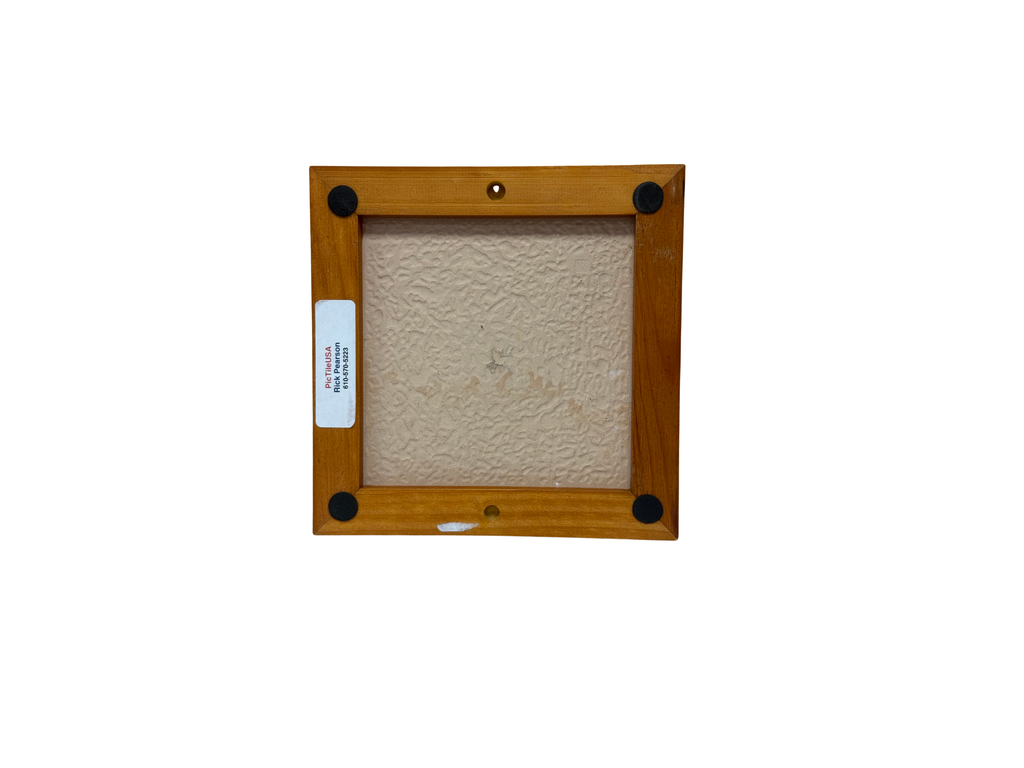 Wooden picture frame with a textured beige center on a white background