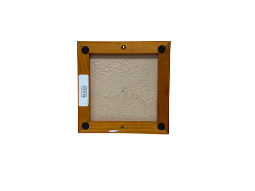 Wooden picture frame with a textured beige center on a white background