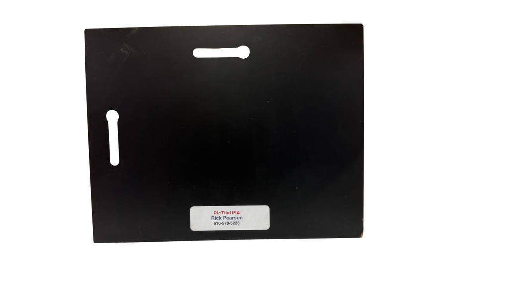 Black rectangular product with a label on a white background