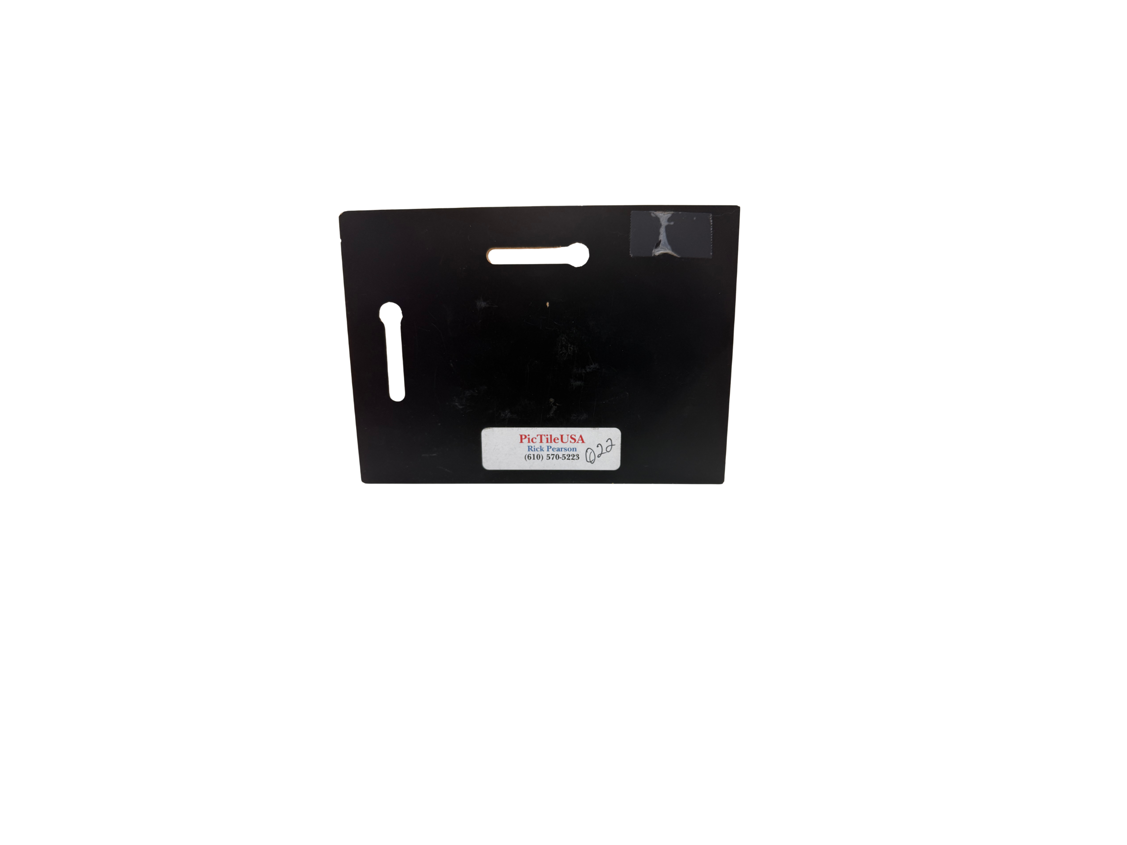 Black rectangular object with a label on a white background