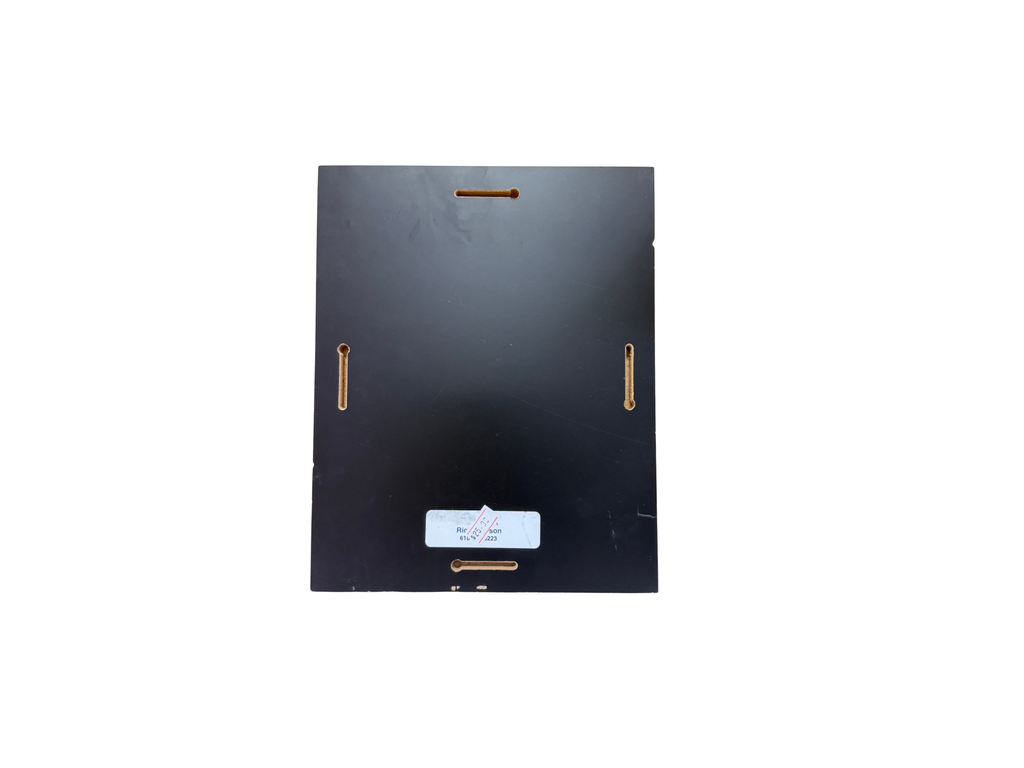 Black rectangular object with gold accents on a white background