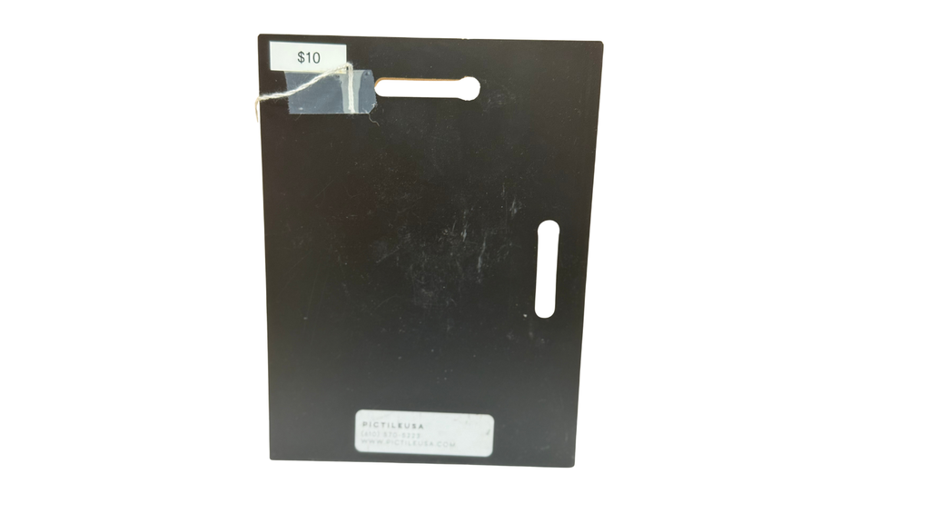 Black rectangular card with a small slit on a white background