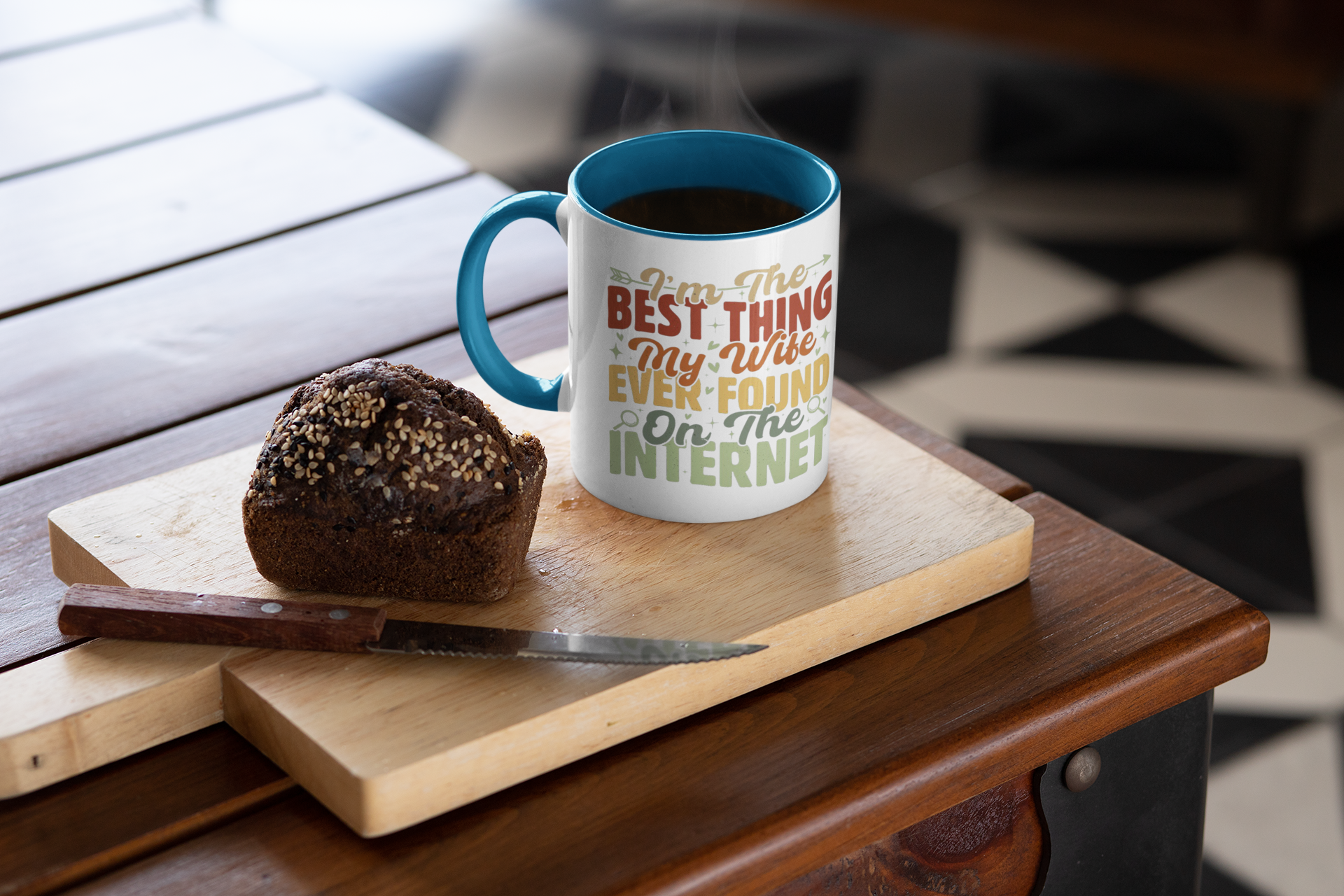 Mug with text on a wooden cutting board with a muffin