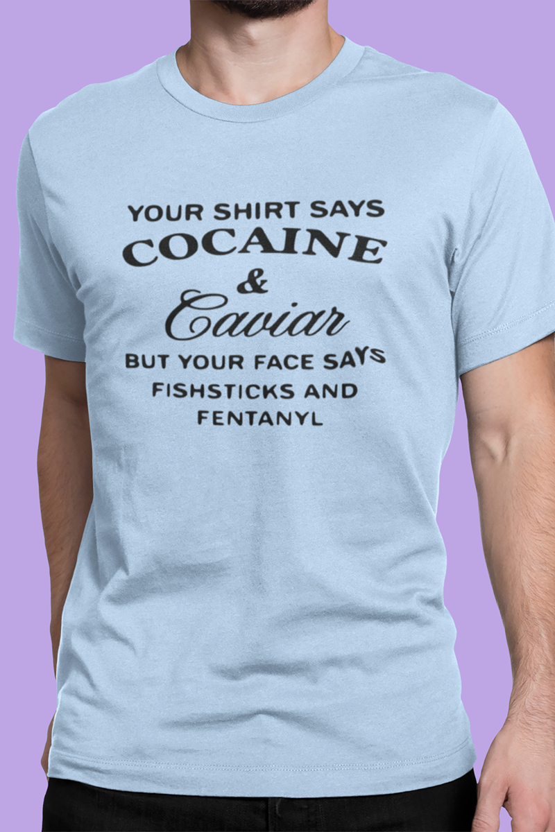 Light blue t-shirt with black text worn by a person on a purple background