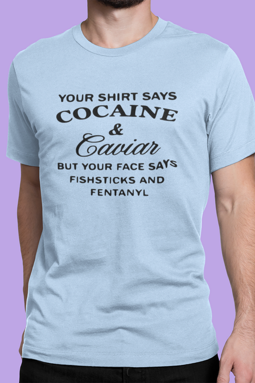 Light blue t-shirt with black text worn by a person on a purple background