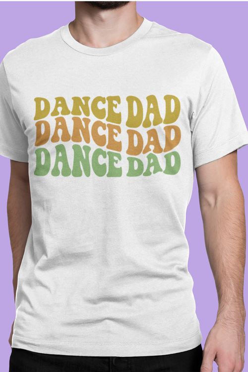 White t-shirt with 'DANCE DAD' text in colorful letters on a purple background