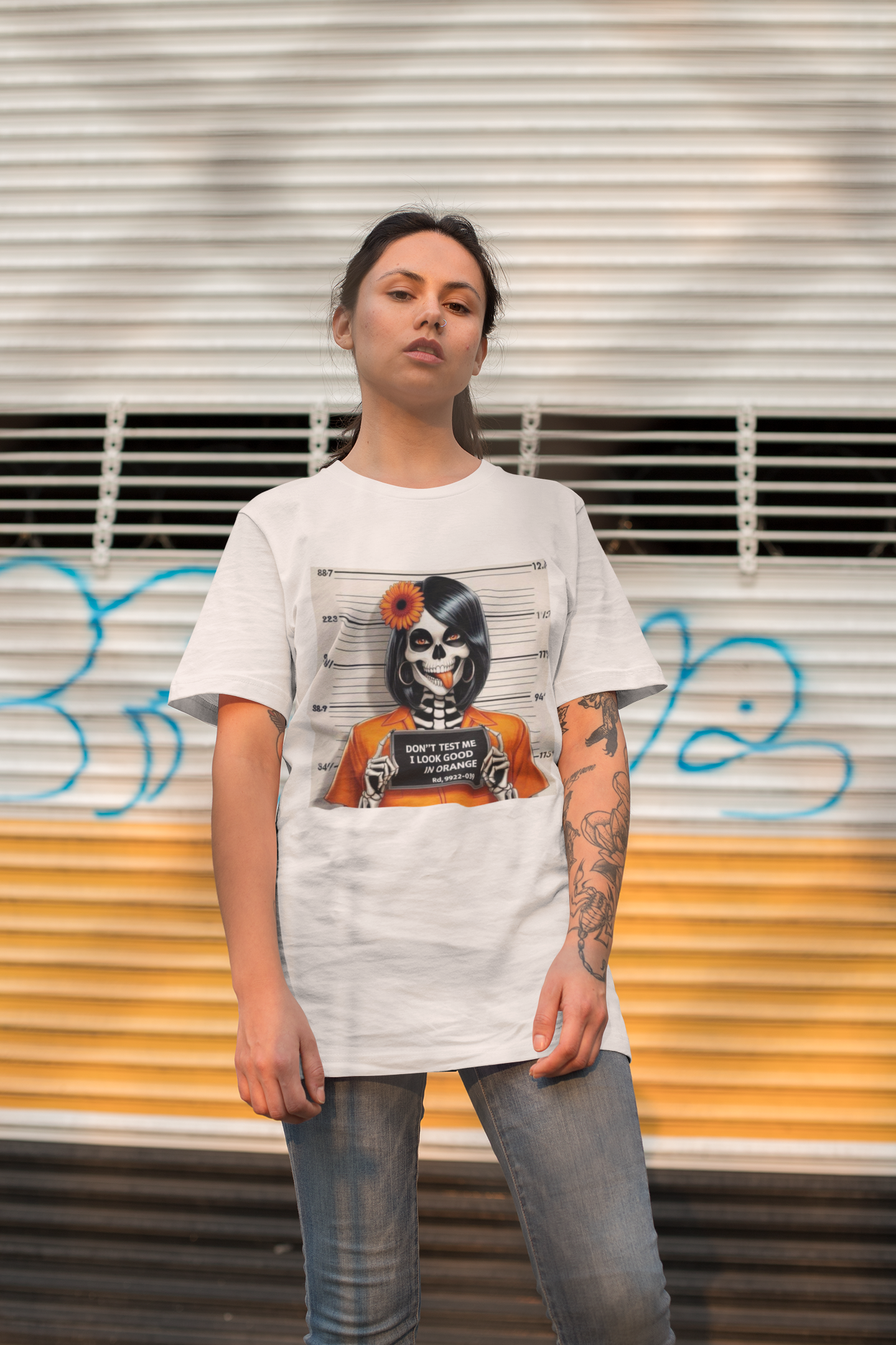 Female skeleton wearing an orange prison jumpsuit graphic on Don’t Test Me I Look Good in Orange t-shirt
