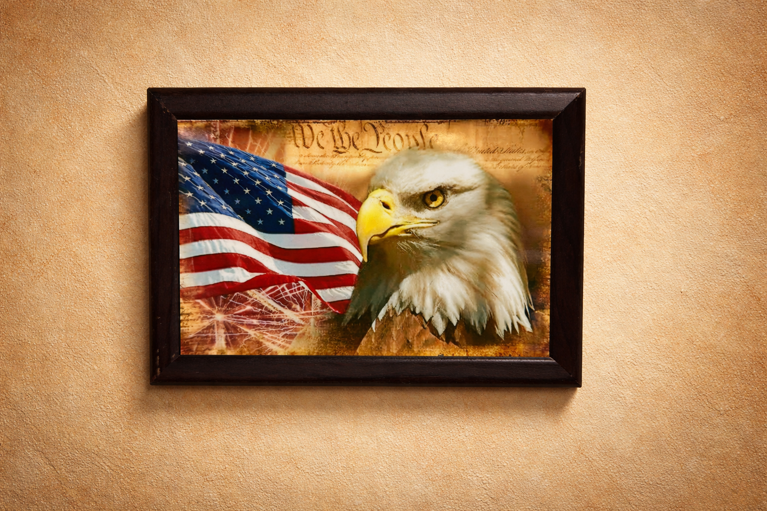 Framed artwork with an American flag and bald eagle on a textured wall.