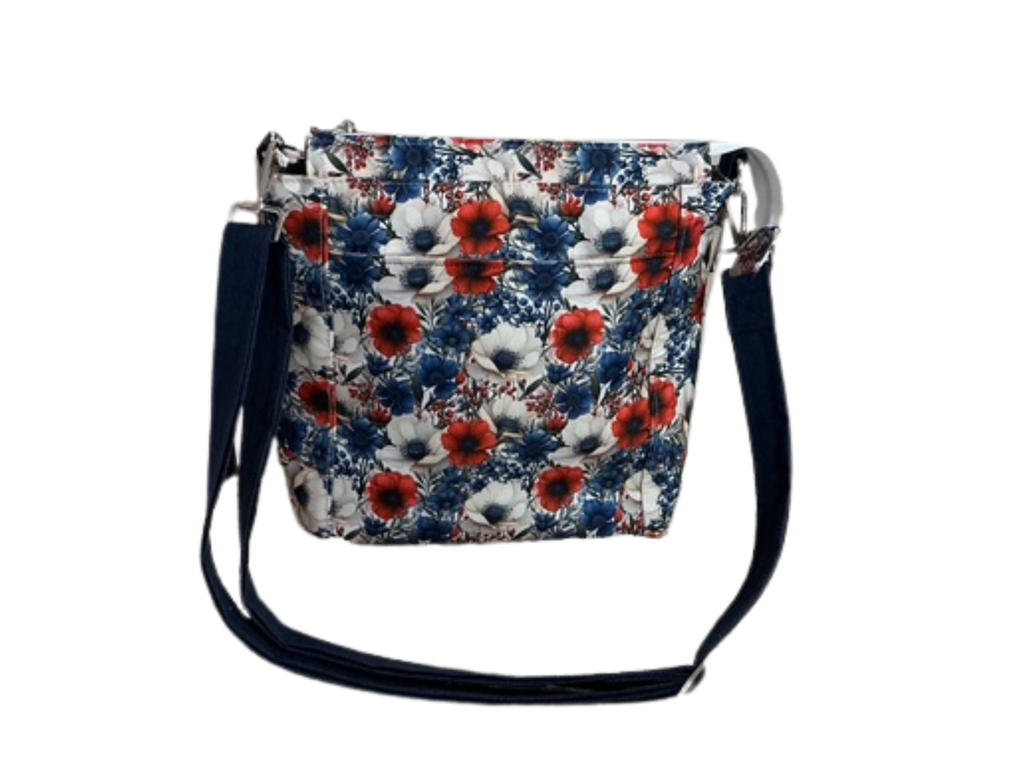 Floral patterned crossbody bag on a white background