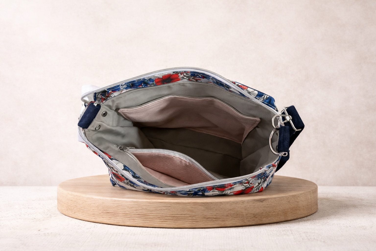 Floral-patterned handbag on a wooden stand with a neutral background