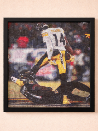 Framed artwork of a football player in action on a beige background