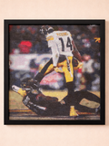 Framed artwork of a football player in action on a beige background