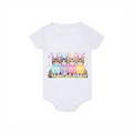 White baby onesie with colorful cat design wearing bunny ears on a white background