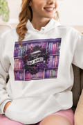 Hoodie with graphic of black book surrounded by black roses that says "Good Girls Read Bad Books"