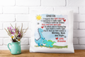 Decorative pillow with dinosaur illustration and text on a white brick wall background