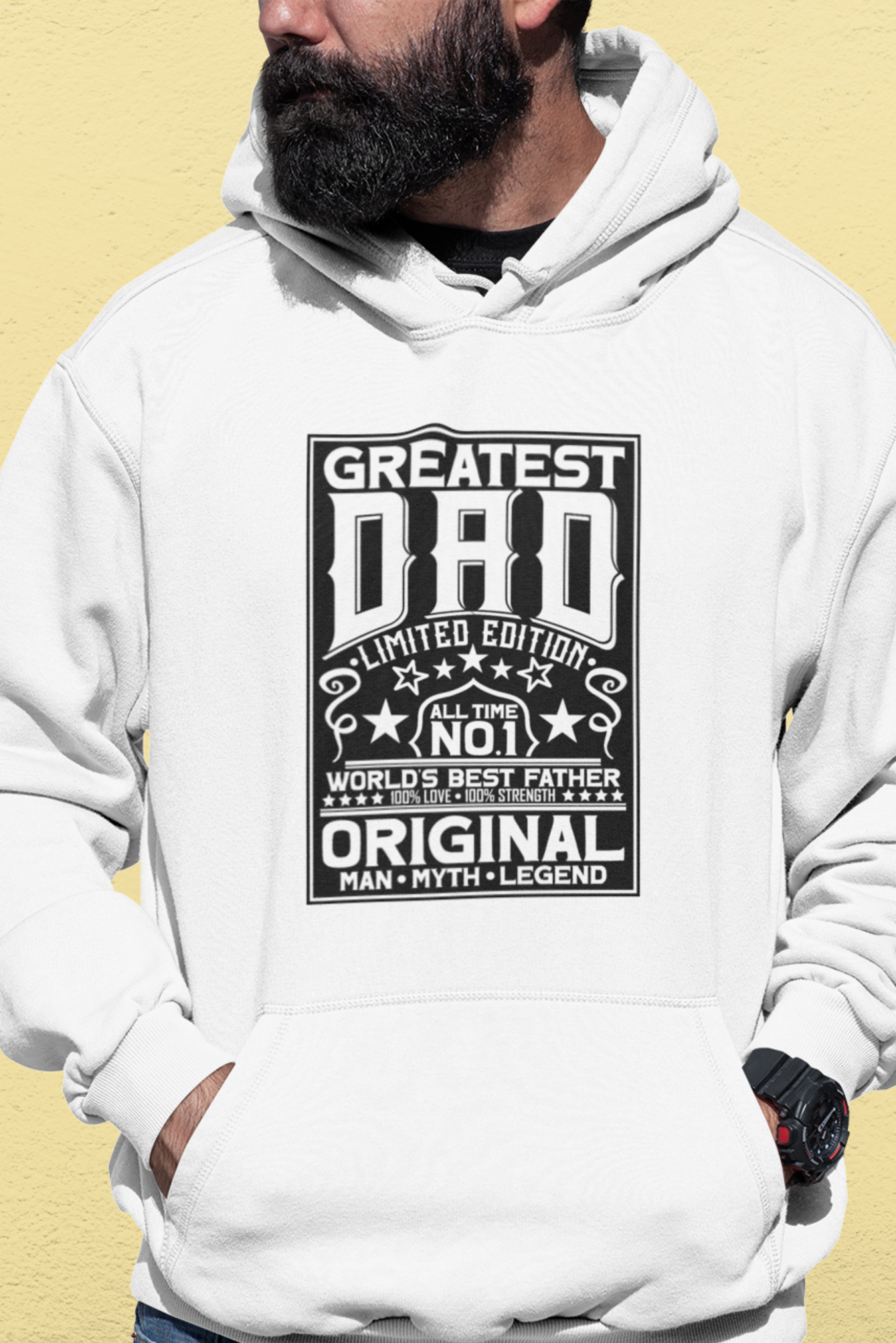 Person wearing a white hoodie with 'Greatest Dad' text on a beige background