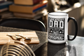 Mug with 'Greatest Dad' text on a kitchen counter