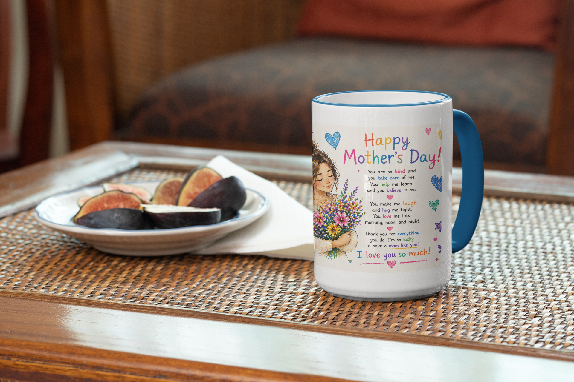 Mug with 'Happy Mother's Day!' text and design on a table with a plate of figs.