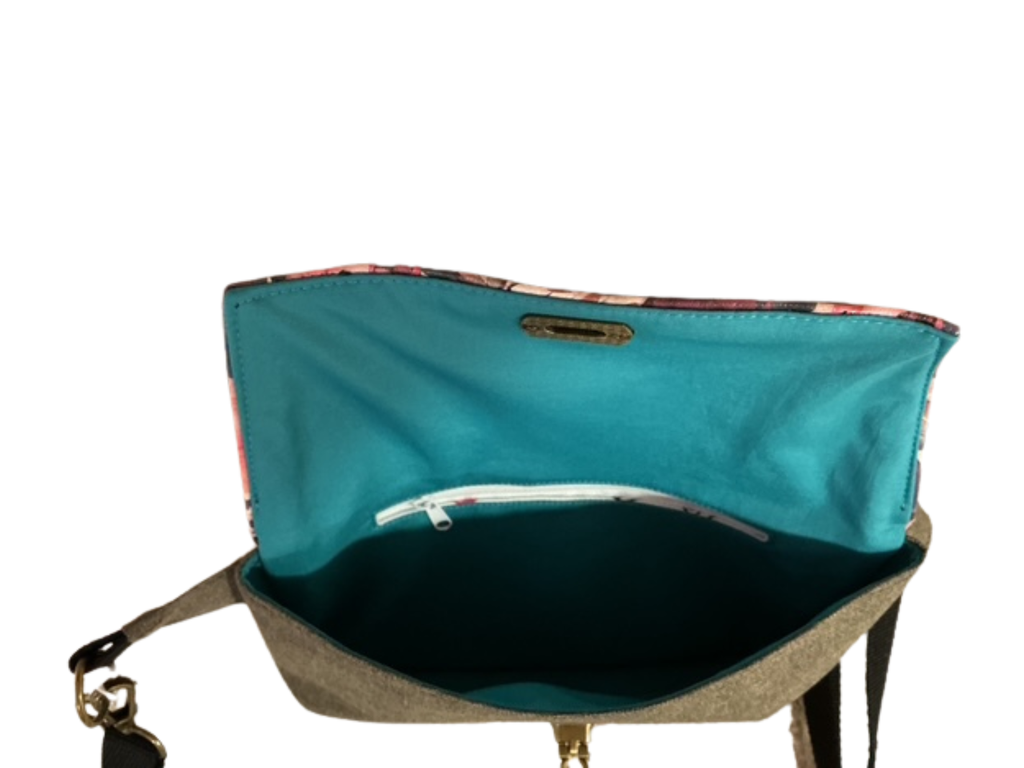 Teal bag with a visible brand logo on a white background