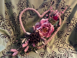Decorative headband with flowers on a patterned fabric background