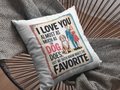Decorative pillow with a humorous quote about love and dogs on a textured surface.
