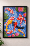 Framed artwork of colorful koi fish and flowers on a textured wall.
