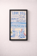 Framed artwork with 'Love you to the beach and back' text and beach scene.