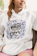 Person wearing a white hoodie with 'World's Okayest Mom' text and floral design.