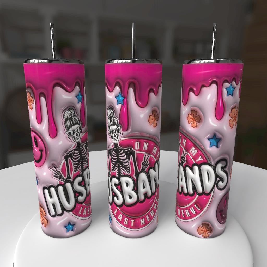 Three pink tumblers with skeleton design and text on a white surface.