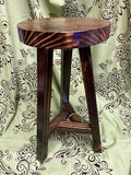 Wooden stool with a patterned fabric background