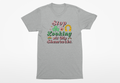 Gray t-shirt with colorful text and graphics on a white background
