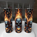 0 oz tumbler featuring graphic of three flaming skulls with flames