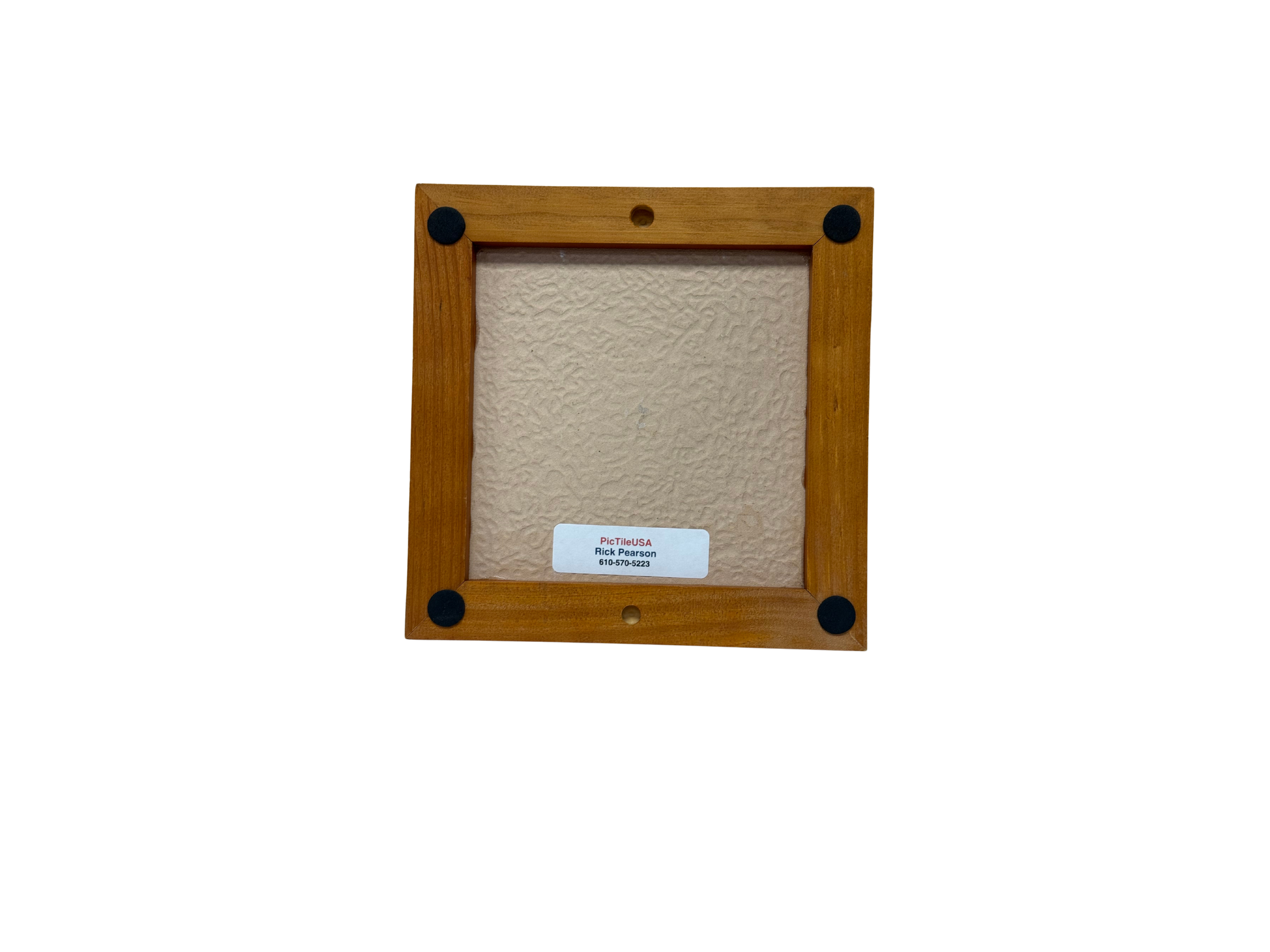 Wooden picture frame with a textured beige center on a white background