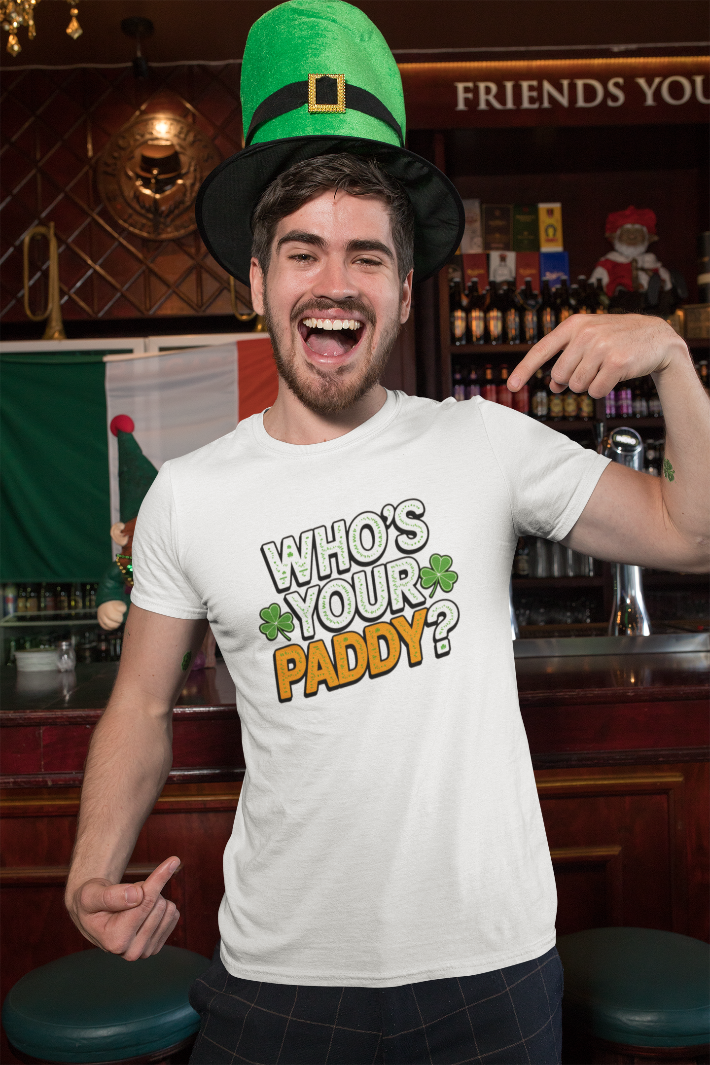Man wearing a 'Who's Your Paddy?' t-shirt in a bar setting