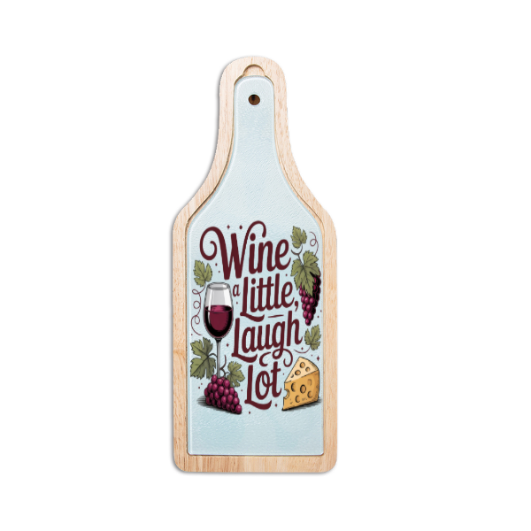 Wooden cutting board with a design of grapes, a glass of wine, and cheese with text 'Wine Little Laugh Lot' on a light blue background.